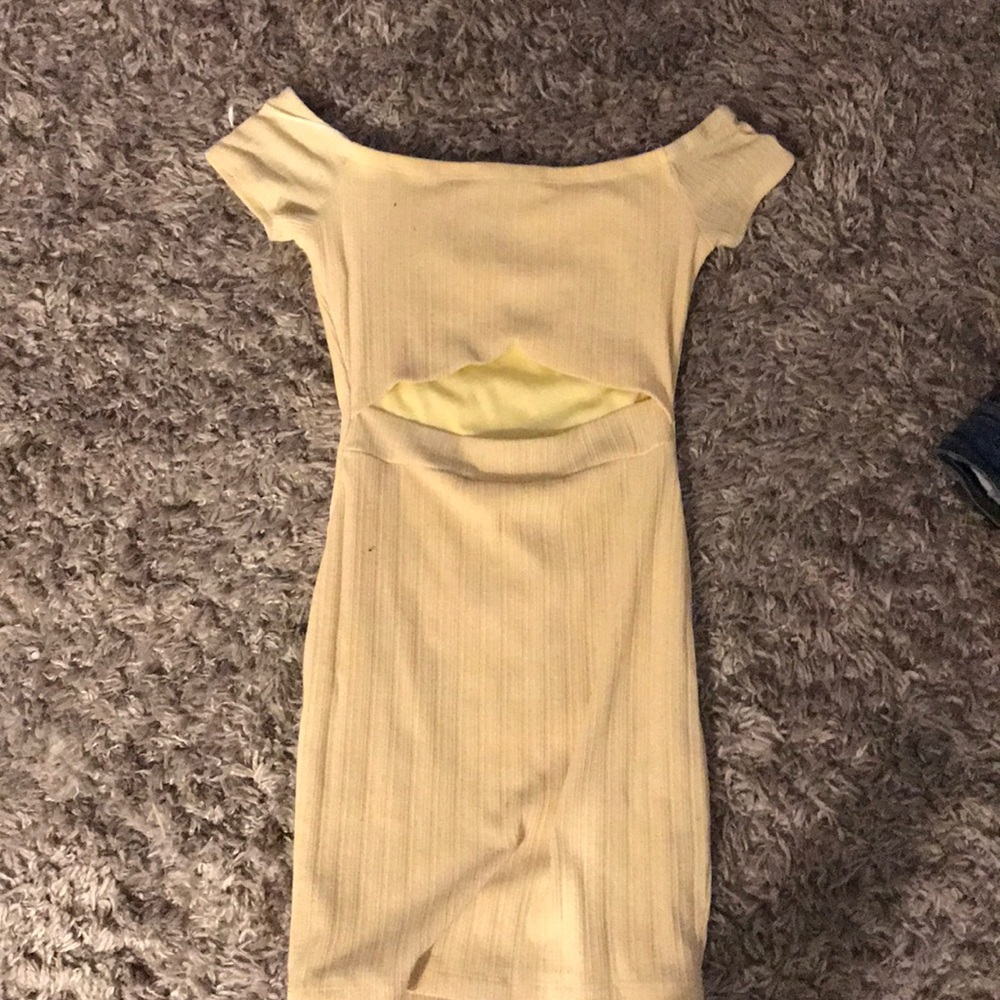 A light yellow dress with a cut in the front